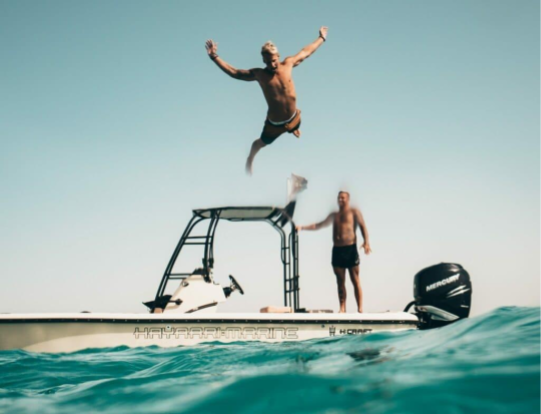 LQ_Blog_man-jumping-off-rented-boat.png