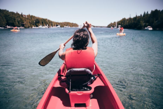LQ_Blog_paddling_red_kayak_on_river.png