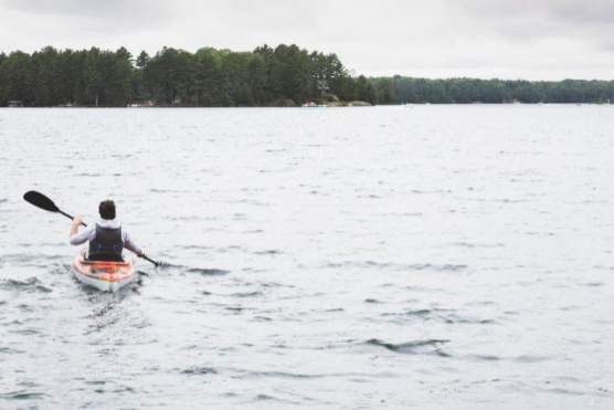 LQ_Blog_person_with_kayak_on_water.png